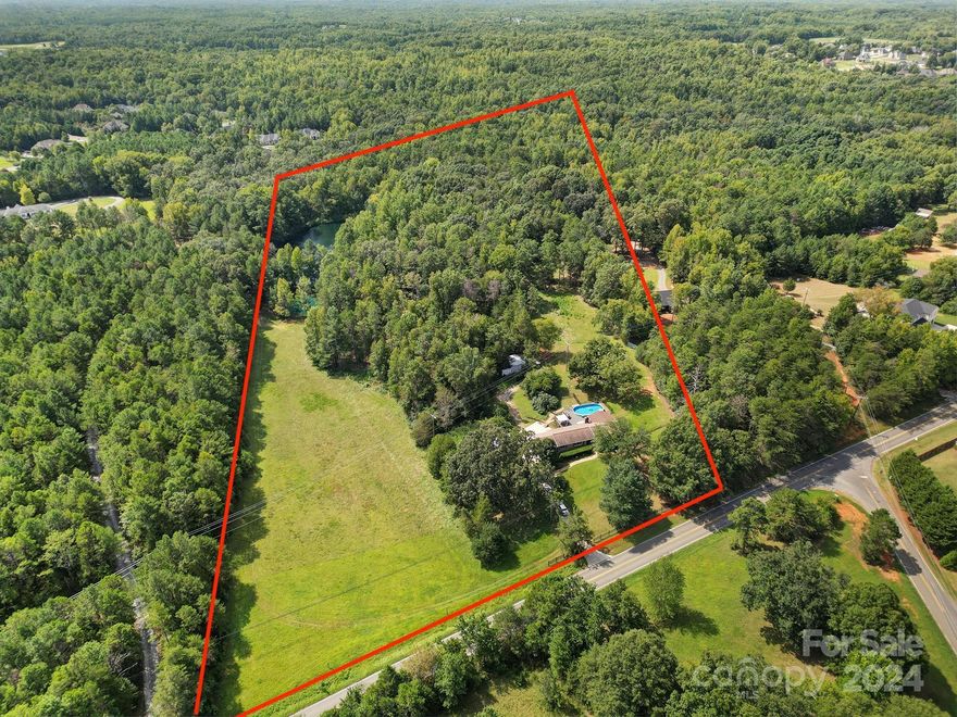 Discover your dream home nestled on 15 sprawling acres in Mint Hill! This majestic property offers a serene escape, complete with a private pond and lush fruit trees. The newly renovated kitchen and master bath showcase modern elegance, while a functional one-level, ranch layout boasts three spacious bedrooms and 2.5 baths. A standout feature is the fabulous walkout basement. Step outside to the massive deck, where you can relax by the beautiful pool and soak in the tranquil surroundings. The property also includes a convenient outbuilding and carport, adding to its functionality. Located in close proximity to I-485, this home offers easy access to all the attractions Mint Hill and Charlotte have to offer, including fabulous restaurants and entertainment. With countless updates throughout, this highly desired home is a must-see, offering endless possibilities for your lifestyle. Don’t miss your chance to own this enchanting retreat!