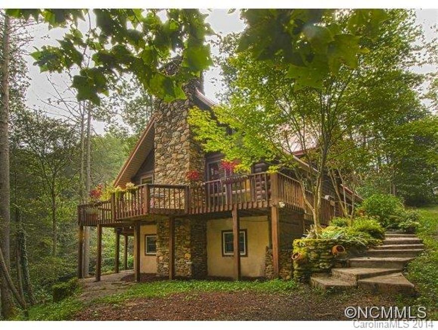 Cedar Log home in an enchanting setting with views and sounds of the 100' Hidden Falls waterfall.  The open floor plan has a 20'rock fireplace and kitchen with granite counters and tile backsplash.  The dining room has access to the wrap around deck for grilling and entertaining. Falls Landing amenities include a pool and park at the base of the waterfall and along a stream.  Suitable for year round or part time living.