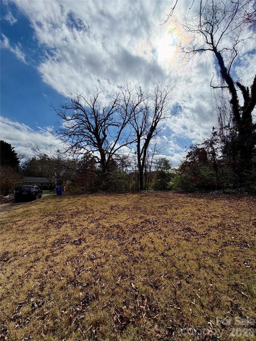 An exceptional opportunity in the coveted Edgewood Place neighborhood. This rare, expansive level lot is set along a picturesque street defined by timeless North Asheville architecture and enduring charm. Surrounded by established homes and mature landscape, it offers a distinguished setting to design and build a truly custom residence.

With easy access from Maney Avenue and the convenience of city water and sewer, the groundwork is in place for a seamless build experience. Ideally positioned just minutes from the amenities of North Asheville and the vibrant energy of downtown Asheville, this location balances privacy with proximity.

A property like this is seldom available—an invitation to create something remarkable in one of Asheville’s most desirable enclaves.