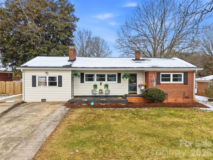 Welcome home to 904 15th St. NW in Conover—a charming, one-level brick ranch nestled in a convenient, established neighborhood. This 3-bedroom, 2-full-bath home offers a thoughtful blend of classic character and modern updates, featuring hardwood floors, a cozy living room with fireplace, and an updated kitchen with stainless steel appliances. Both bathrooms have been modernized, and many of the windows in the home have already been replaced for added efficiency.

An additional bonus/flex space with its own private entrance provides possibilities—perfect for a home office, studio, or guest area. Step outside to what truly sets this home apart: the backyard. Enjoy an oversized back deck with a covered awning, a fenced yard, and a detached garage with power—ideal for a home gym, hobby space, workshop, or extra car storage.

Full of charm, functionality, and outdoor living space, this Conover gem won’t last long. Come see it before someone else snatches it up!