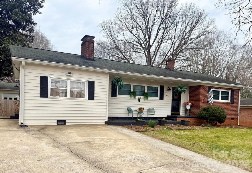 Welcome home to 904 15th St. NW in Conover—a charming, one-level brick ranch nestled in a convenient, established neighborhood. This 3-bedroom, 2-full-bath home offers a thoughtful blend of classic character and modern updates, featuring hardwood floors, a cozy living room with fireplace, and an updated kitchen with stainless steel appliances. Both bathrooms have been modernized, and many of the windows in the home have already been replaced for added efficiency.

An additional bonus/flex space with its own private entrance provides possibilities—perfect for a home office, studio, or guest area. Step outside to what truly sets this home apart: the backyard. Enjoy an oversized back deck with a covered awning, a fenced yard, and a detached garage with power—ideal for a home gym, hobby space, workshop, or extra car storage.

Full of charm, functionality, and outdoor living space, this Conover gem won’t last long. Come see it before someone else snatches it up!
