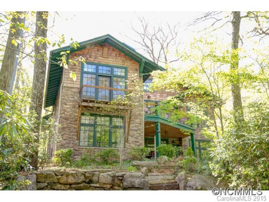 Hear the rushing creek from lower level patio, large upper level deck or balcony of your private master suite.This custom home in Montreat has cathedral ceilings with exposed beams, open concept with grand stone fireplace, gourmet kitchen,lg windows bring in lots of natural light. Low maintenance, private lot w/natural landscape of rhododendron, laurel & rock. Master suite on main level. Plenty of room to entertain in this amazing home.