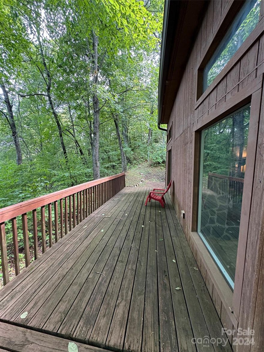 BACK ON THE MARKET.  BUYER BOUGHT FROM A VIDEO TOUR THAN CHANGED HIS MIND WHEN HE ARRIVED.  UGH! 

COME AND GET THIS CONTRACTOR'S DELIGHT! Investor seller has made many improvements but after an unscrupulous roofer took off with the money she's calling it quits. Her loss is your gain. This home features amazing views of Clingman's Dome and features 3 bedrooms and 2 full baths. Nestled on 3.5 +/- acres in the Battle Branch Subdivision, it's ready for you to finish it and make it yours! Home includes a working wood burning fireplace, wood burner stove, working heat and air conditioning and kitchen appliances. Owner has lived there throughout her renovation process. The flooring has been removed, ceilings have been painted and partial walls have been removed. There is a basement that used to be a one car garage that is dry. More details available. Priced to generate offers so call today!