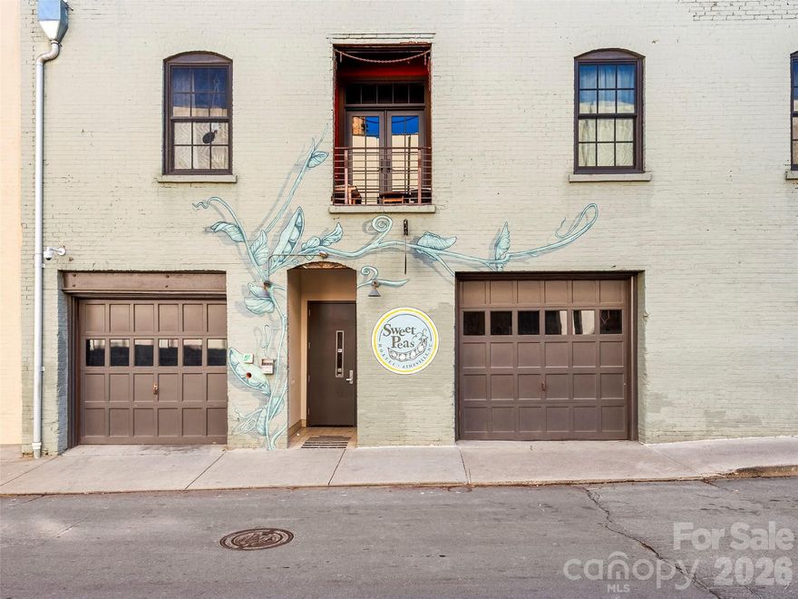 39 N Lexington Ave, Unit 2 presents a rare opportunity to acquire a character-rich, flexible-use space in the heart of downtown Asheville. Currently operating as Sweet Peas Hostel, the property offers a unique layout with expansive common areas, multiple private rooms, and existing kitchen and full bath infrastructure already in place. Exposed brick, hardwood floors, and abundant natural light create an authentic environment well suited for creative office, boutique hospitality, live/work, or wellness-oriented concepts. Located in one of Asheville’s most desirable and walkable corridors, the property offers a compelling opportunity for an owner-user or investor seeking a distinctive downtown asset.