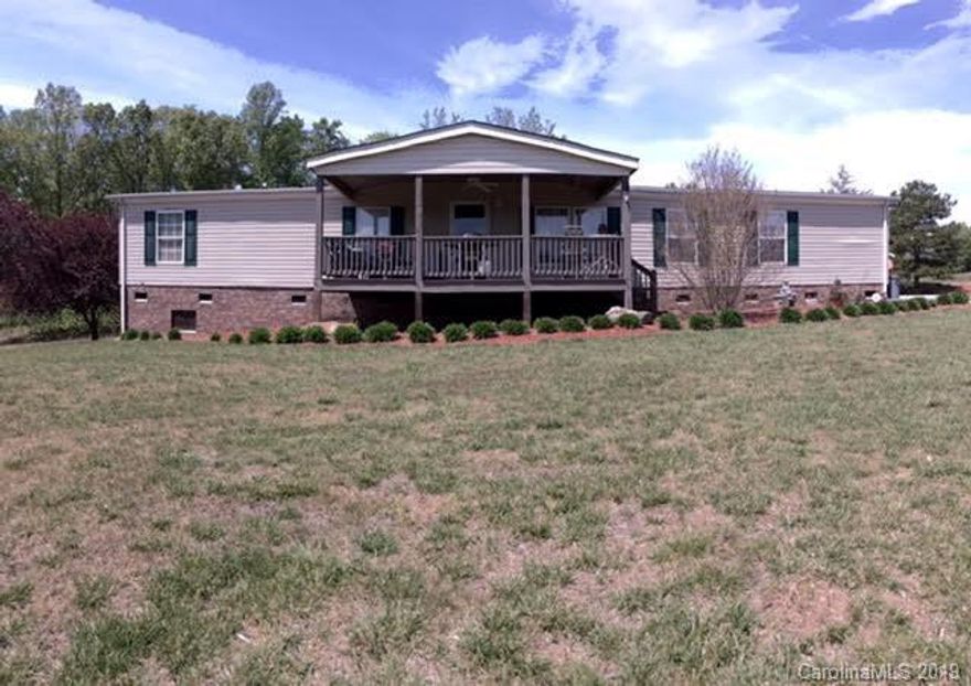 This gorgeous property is one of a kind and an outdoor lovers dream. The almost 10 acres are mostly cleared and fenced in. The home has a great layout with 3 bedrooms & a hall bath on one side and a HUGE master bedroom on the other. The master boasts a private office/parents retreat. The master bath has a soaker tub, stand up shower, and dual vanity. The walk-in is accessible from the bedroom and master bath. There is a living and family room that is open to the spacious kitchen w/ SS appliances. The home has a great covered front porch where you can enjoy mtn. views. Out back is large porch and double carport.