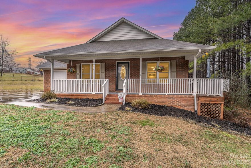 Immerse yourself in the allure of this 3-bed, 2-bath ranch-style gem, a brick haven set on nearly 1 acre of sprawling, flat land. The open floor plan seamlessly connects living spaces, culminating in a gourmet kitchen, a hub for both daily life and entertaining. Find serenity on the expansive front porch, a perfect retreat for leisure and gatherings. Three bedrooms offer flexibility and comfort, creating an ideal blend of style and practicality. This residence transcends a mere home; it's a sanctuary where design harmonizes with nature. Enjoy vast space indoors and out, with the flat land inviting recreational pursuits and expansion possibilities. Welcome to a lifestyle curated for immersive experiences. This ranch-style retreat promises a harmonious blend of elegance, comfort, and the tranquility of natural beauty. Your dream lifestyle awaits in this captivating residence – a timeless fusion of design and serenity.