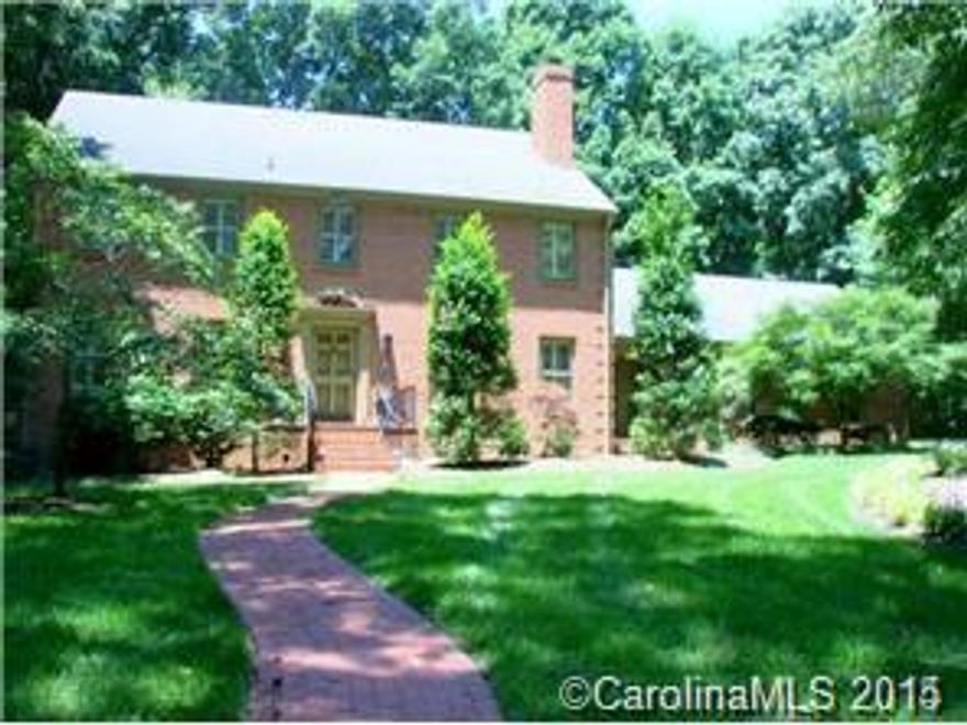 Welcome Home.  This custom built brick Colonial home sits on over a .6 acre lot with mature trees and private backyard. The home features 4 large bedrooms (including master) on the second floor and a main level study with walk in closet that could also be used as a 5th bedroom.  Generous size master bedroom includes 3 closets and en suite bath with double sinks and separate water closet.  Huge mud/laundry room off of the kitchen has its on side entrance.  Home includes large formal areas and den with wet bar, hardwood floors, fireplace w/gas logs, and ceiling fan.  Walk up third floor/attic is partially finished and not included in the heated square footage.  Custom details and plantation shutters throughout.  Must See!