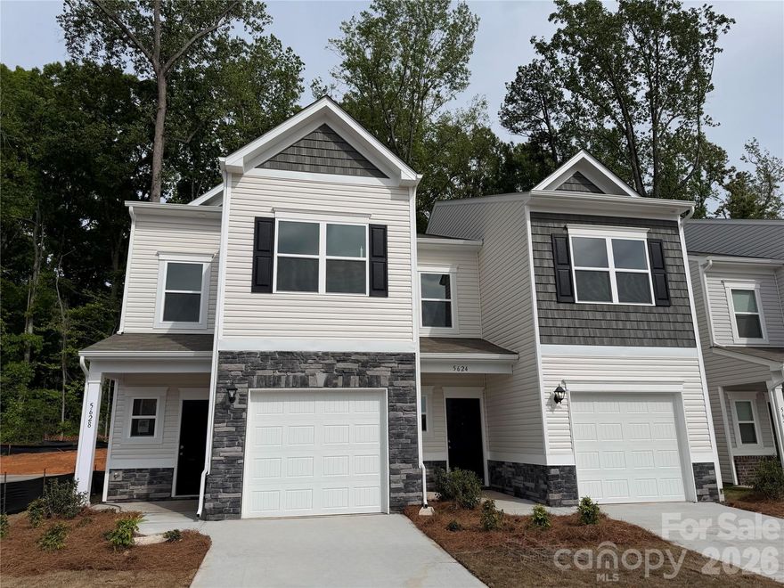 Discover the Trenton floorplan in Hickory Glen, a charming boutique community located just minutes from Uptown Charlotte. This two-story, low-maintenance end-unit townhome offers 1,287 square feet of well-planned living space, featuring 3 bedrooms and 2.5 bathrooms. The main level showcases an open-concept design with a stylish kitchen complete with 36" cabinetry, granite countertops, a spacious island, stainless steel appliances, and a pantry. The kitchen flows effortlessly into the family room, creating a comfortable and functional space ideal for both everyday living and entertaining.

Upstairs, the primary suite provides a relaxing retreat with a walk-in closet and a private bath featuring dual quartz vanities and a large shower. Two secondary bedrooms, a full bath, and a conveniently located laundry space round out the second floor. Hickory Glen offers a unique setting with just 46 duet-style homes, each designed as an end unit to maximize privacy and natural light.