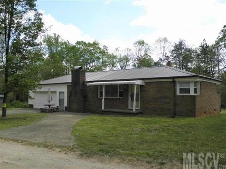 We'll let you do the remodeling at this price. Great brick ranch with over sized double garage. 2 bedrooms and 1 full bath. Large kitchen, living room and den. Plenty of room for gardening on this level nearly 1.40 acres. Roof was replaced in 2013. Lots of potential.