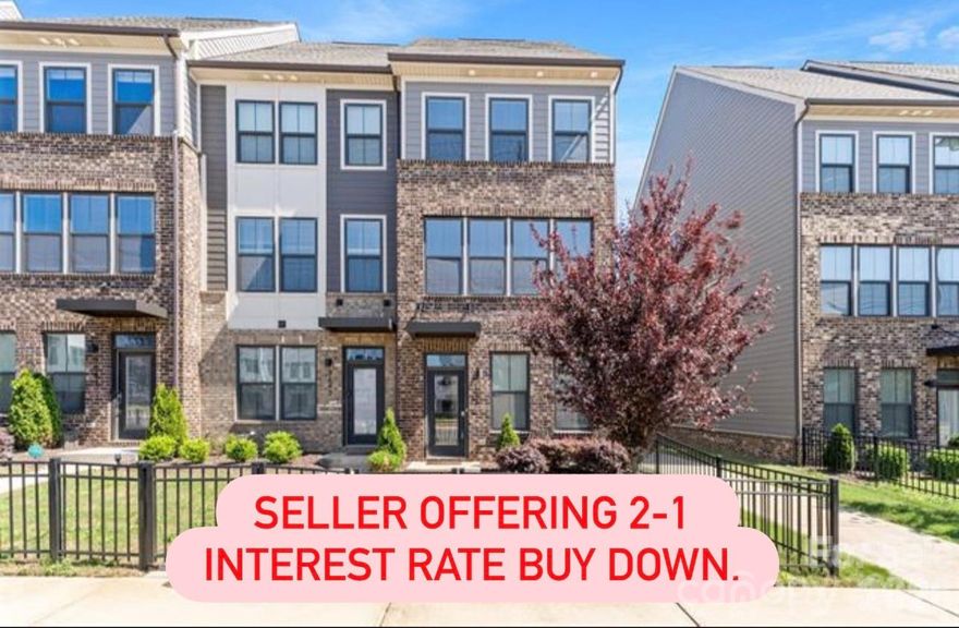 This unit features a 2-car garage with parking area, visitor parking and public street parking.  You are guaranteed 2 spots with the garage which most other complexes don't have- (huge bonus), 3 beds, 3.5 baths. Beautiful three-story town home in South End- walk to Phat Burrito and nearby breweries. Top floor has a bedroom, full bath, loft and large outdoor terrace with partial city views.  Very private.  The main level is open with beautiful modern kitchen- island, stainless steel appliances, refrigerator, tile back splash and large dining area. Large owner's suite with walk in closet. End unit with more windows. Beautiful flooring and selections on this unit. New carpet and fresh paint. Can rent- no wait lists or caps, something other complexes limit so be sure to check. You can park TWO cars in the garage, be sure to mention. SELLER TO PAY UP TO $10,000 TOWARDS A TEMPORARY 2-1 INTEREST RATE BUYDOWN. Terms and conditions apply.