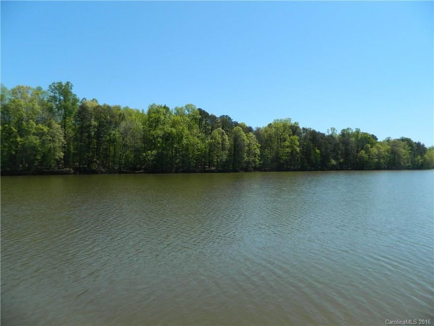 Lake front property with beautiful view and quiet setting. Great 2nd home for weekend getaway! Property has dock and boat access to lake. Great for fishing, tubing, boating, bird watching, etc. The serenity of this quiet cove awaits you!