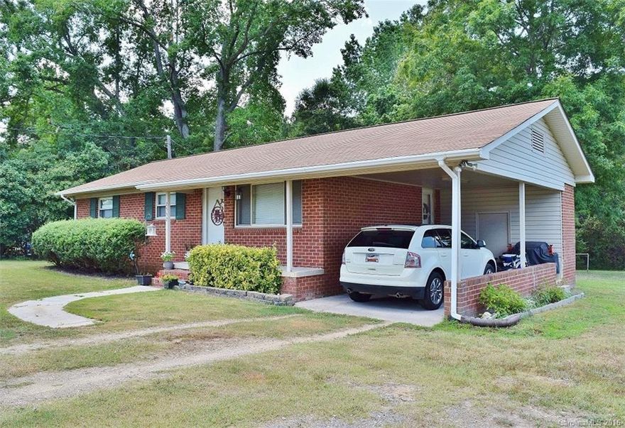 Phenomenal all-brick ranch in the countryside, yet close to city conveniences.  Beautifully updated with laminate hardwoods throughout as well as new countertops and backsplash in the kitchen.  Enjoy the total privacy of your very own corner lot with storage building. Easy to maintain, monthly payments less than rent, and kitchen appliances remaining; the only thing you'll have to worry about is burgers or brats. New HVAC Installed 7/7/2016!