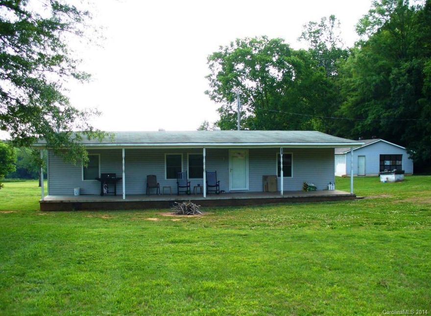 This 3 bedroom/2 bathroom home has almost 2.50 acres of country setting.  Plenty of land for your privacy.  Lots of wildlife.  Newer roof, windows and HVAC.  48x8 covered front porch and large deck on the back of the home to enjoy the open space.  Large block garage/shop.