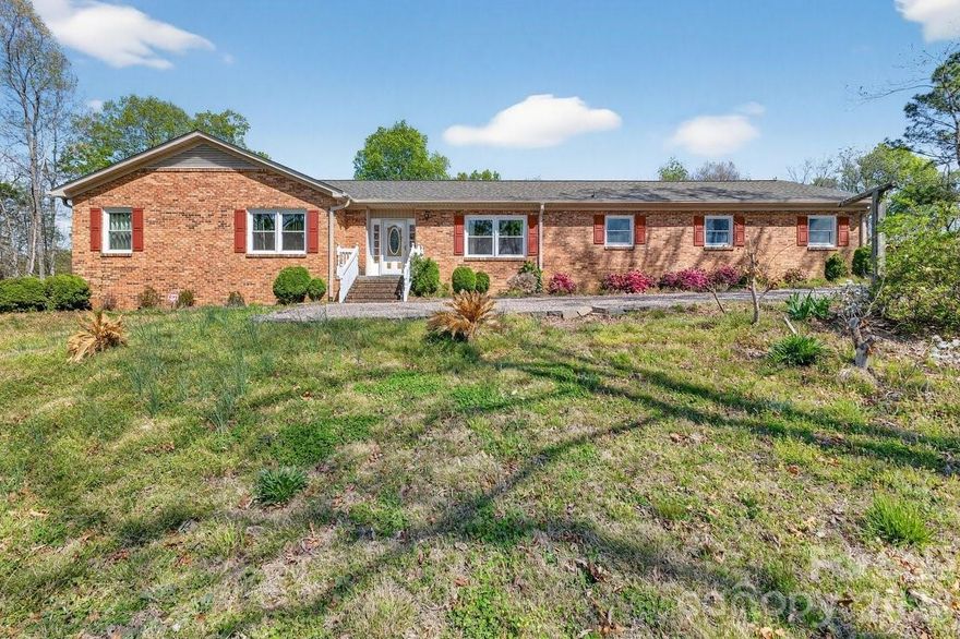 Welcome to this inviting 3-bedroom, 3-bath home set on approximately 2 acres, easily accessible from I-85 highway.  The main level features an open-concept living and dining area with abundant natural light, a well-appointed kitchen, and a primary suite with a private bath. Two additional bedrooms and a full bath complete the main living floor. The partially finished basement provides flexible extra space — ideal for a family room, home office, or gym — plus storage and utility areas. Outside, enjoy expansive yard space perfect for gardening, play, or future outdoor projects. Conveniently located yet private, this property offers the perfect balance of comfort and quaint living. Additionally, a new roof was added in 2025.
