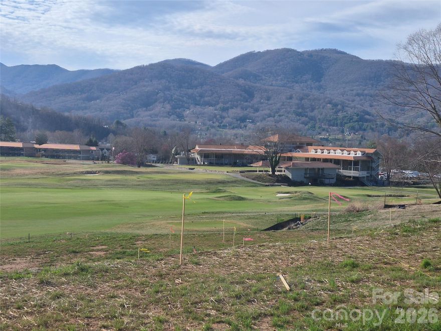 Be the first to build a home bordering the 10th fairway of the prestigious and newly renovated Waynesville Inn and Golf Club. This excellent lot offers magnificent views of the clubhouse, the 10th and 18th holes, and mountains all around. The lot offers a newly paved road for access and underground utilities waiting for you to build the mountain dream home you deserve. Contact me for more information about joining this historic club originally designed by Donald Ross and getting started with your building project. Build here and you'll enjoy close proximity to the clubhouse, pro shop, restaurants, driving range, pool, himalayan putting green, multi-green short game area and more. Just minutes to historic downtown Waynesville and many more shops and dining opportunities. A Social Membership Initiation Fee for your membership to Waynesville Inn & Golf Club is included in the price! Dreams come true at Waynesville Inn and Golf Club. You won't be disappointed!