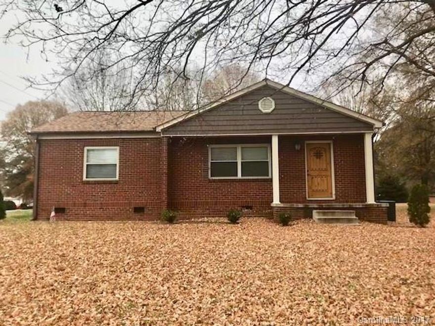 Cute brick ranch home located on a corner lot with a large yard. Updated with tile in kitchen and bathroom and new refinished hardwoods throughout. New cabinets in kitchen and bath and fresh paint. Walk way outback leads to storage room, laundry room and garage. Multiple opportunities. Zoned commercial with residential use for now.