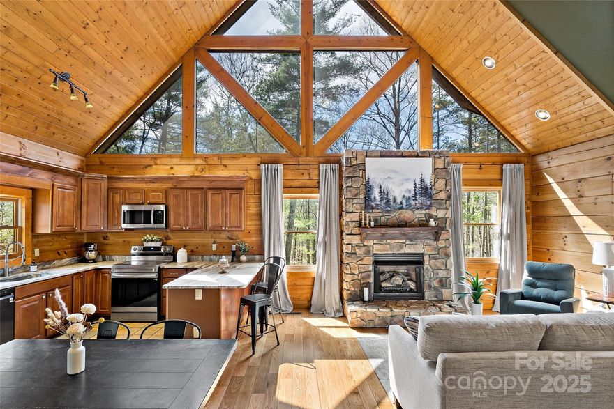 Nestled in the woods for ultimate privacy yet easily accessible, this beautiful log cabin offers the perfect blend of rustic charm and modern updates. Vaulted ceilings and large western-facing windows fill the home with natural light, highlighting the newly refinished hardwood floors. The open-concept kitchen boasts new granite countertops. A spacious primary bedroom and large bath on the upper level and lower level bonus room with ample extended garage storage provides plenty of flexibility. Conveniently located 15min from skiing and 25 min to Downtown Asheville. Enjoy the serenity of nature with all the comforts of home! Great STR.
5K credit (for buyer discretion- but exterior needs staining.)
Additional features include:
Two-car garage
Backup "Hardy" outside hydronic heater
New- Bosch HVAC, well pump, roof, stainless kitchen appliances, preventative pest treatment on wood and more (see agent remarks)