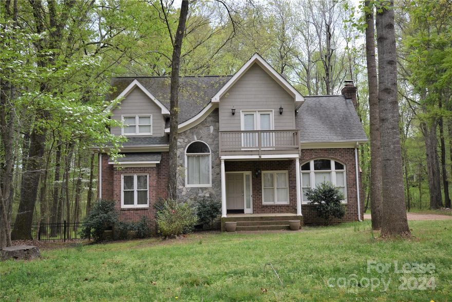 Come home to this Tuscan influenced home tucked among the trees. Perfect corner wooded lot! Lovely front porch leads to the large open foyer. Two-Story great room with stone fireplace and new LVP floors. Open kitchen and dining area with stainless steel appliances. Mud room with washer and dryer hookups with access to the 3 bay garage with a lot of space and great storage above the garage. Inviting deck off dining area to enjoy time outdoors over looking the wooded fenced back yard. Primary Bedroom on the main level with new LVP Floors and large Primary bath with double vanities , garden tub and separate shower. Large walk in closet. Upstairs has Huge open loft area with balcony and wet bar over looking the family room showcasing new LVP floors as well. Two additional bedrooms and full bath.  Located just moments from 485.