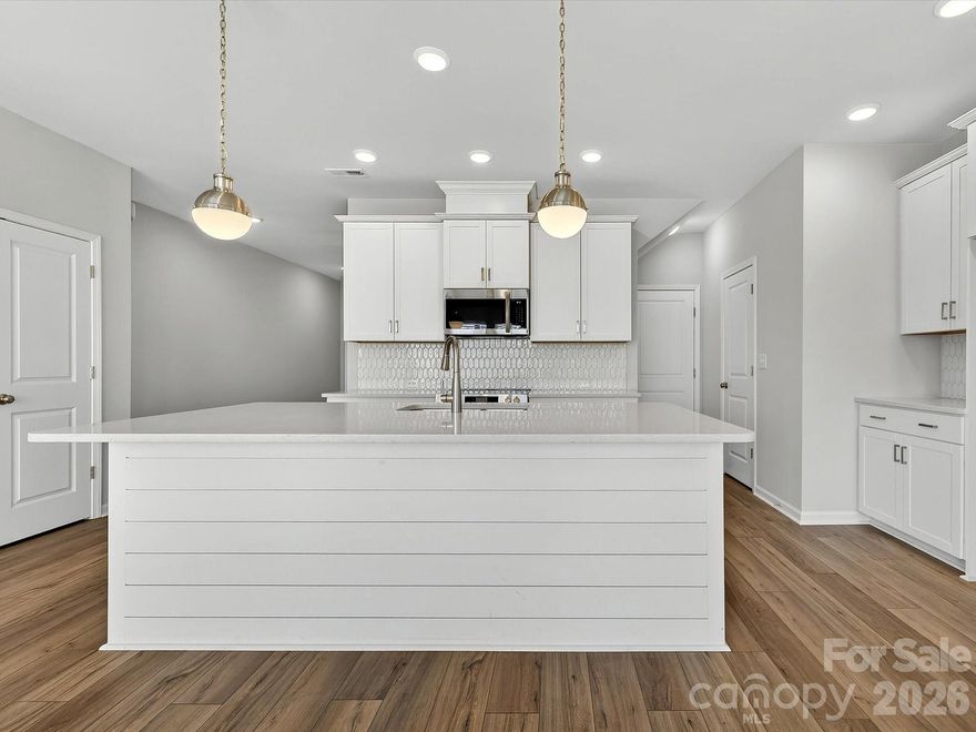 Discover the Thornhurst I at Westview Towns, where the charm of Downtown Waxhaw’s shops and restaurants meets modern comfort and convenience. This beautifully designed townhome offers the spacious feel of a single-family home with the lock-and-leave ease of low-maintenance living.
Step inside and experience open, light-filled living spaces designed for both style and function. The kitchen showcases curated finishes, including elevated quartz countertops, shiplap accents, solid shelving in the pantry, an oversized island, 42" cabinetry with soft close doors & drawers, Frigidaire appliances—the perfect blend of elegance and practicality.
Thoughtful details like LVP stair treads that coordinate with the main-level flooring add warmth and flow throughout the home. Oversized picture windows bathe each room in natural light, while walk-in closets in every bedroom provide exceptional comfort and storage.
Enjoy relaxing on the covered rear porch, where lawn maintenance is handled for you—leaving more time to savor the Waxhaw lifestyle.