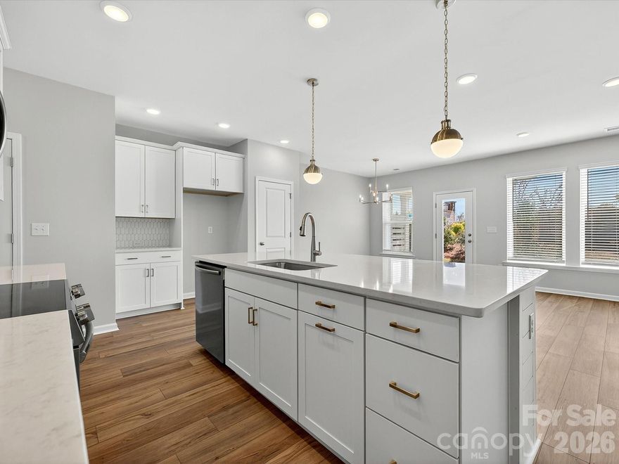 Discover the Thornhurst I at Westview Towns, where the charm of Downtown Waxhaw’s shops and restaurants meets modern comfort and convenience. This beautifully designed townhome offers the spacious feel of a single-family home with the lock-and-leave ease of low-maintenance living.
Step inside and experience open, light-filled living spaces designed for both style and function. The kitchen showcases curated finishes, including elevated quartz countertops, shiplap accents, solid shelving in the pantry, an oversized island, 42" cabinetry with soft close doors & drawers, Frigidaire appliances—the perfect blend of elegance and practicality.
Thoughtful details like LVP stair treads that coordinate with the main-level flooring add warmth and flow throughout the home. Oversized picture windows bathe each room in natural light, while walk-in closets in every bedroom provide exceptional comfort and storage.
Enjoy relaxing on the covered rear porch, where lawn maintenance is handled for you—leaving more time to savor the Waxhaw lifestyle.