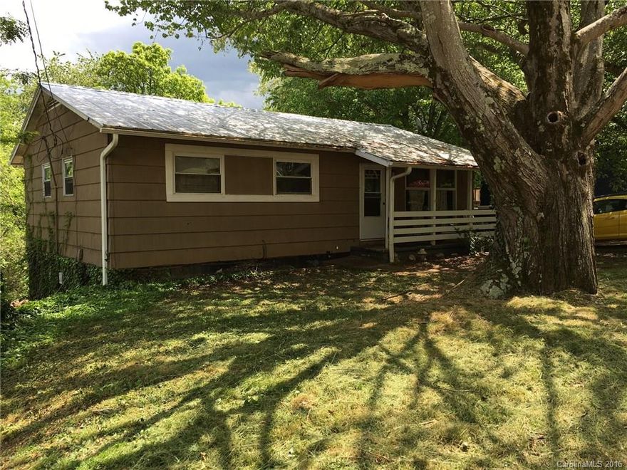 It is a West Asheville Deal! Double lot (see attached). House lives well! Main level offers traditional Ranch floor plan w/ spacious Kitchen, Oak hardwood floors & tile hall bath. Lower level features include high ceilings & sunlit space w/ tile floors, fourth bedroom & full bathroom in the lower level living area that walks out slider onto rear patio. A fire ring & level space to boot. Currently tenant occupied month to month - does need some elbow grease & likely fresh paint for new owner.