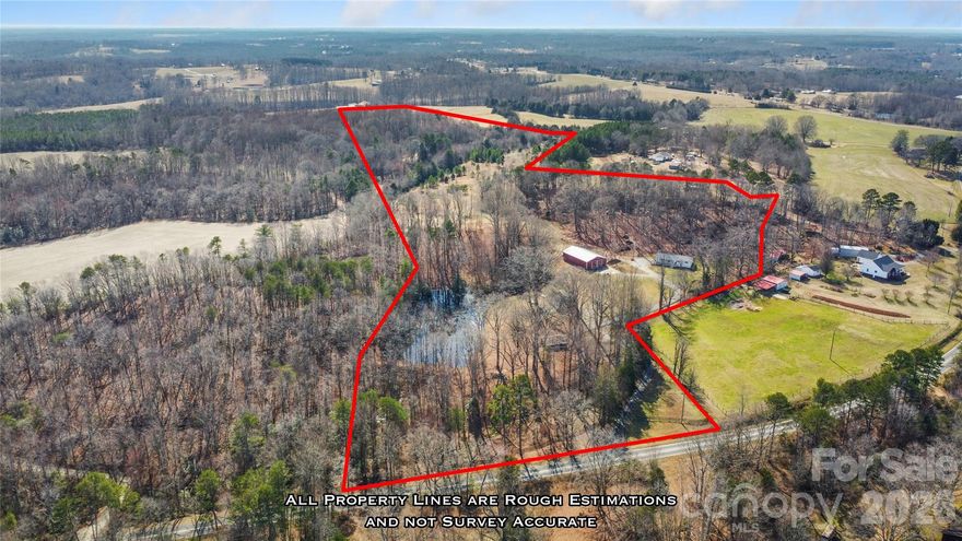 This exceptional 32.20-acre estate offers peaceful country living with rare versatility. Three parcels include two homes, a ¾-acre pond, a 2,900+ sq ft workshop w/concrete floor, partially heated, and outstanding privacy~ ideal for multi-generational living, income potential, or room to grow. (MLS 4335704, 4335702 & 4347630)

House #1 features an open floor plan filled with natural light, highlighted by a spacious family room with bay window. The updated kitchen offers a large island, soft-close white cabinetry, tile backsplash, and new white appliances. The private primary suite includes a beautifully renovated bath with double vanity, shower/tub combo, LVP tile flooring, and oversized walk-in closet. Two guest bedrooms share a stylish full bath with custom tile shower. Both full baths include Bluetooth speakers. Laundry room, half bath, new roof/gutters (2025), complete the home. Over 27 partially cleared acres provide endless possibilities for recreation, animals, or expansion.

House #2 offers a private retreat overlooking the pond. Enjoy an open layout, spacious kitchen with abundant cabinetry and glass-front accents, primary bedroom with pond views, pine bedroom floors, LVP in main areas, pine floors in bedrooms, plus a large laundry room with utility sink, full bath and closet space. Updated windows, plumbing and electrical.  A 2,933 sq ft engineered metal building with concrete floors, loft and finished spaces (one area heated) and a 611 sq ft pole barn add exceptional flexibility. Shown by appointment only. Do not enter driveway without approval.
Each home in MLS individually and then combined. See MLS# 4335704, 4335702 for individual home details.