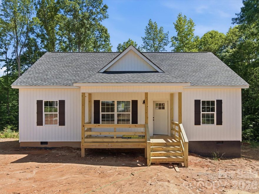 Stunning new construction craftsman situated on 1.68 acres on a cul-de-sac lot in sought after Clover! Tucked away in a peaceful setting while still convenient to both Clover and York, this thoughtfully designed one level home features an open layout and timeless neutral finishes throughout. Luxury vinyl plank flooring, custom details, and an inviting electric fireplace add warmth and style to the spacious living area. The kitchen is equipped with shaker style cabinetry, quartz countertops, and a large center island ideal for gathering and entertaining. The private primary suite offers a walk in closet, dual vanity, and walk in shower. Two secondary bedrooms, a full bath, and laundry room provide comfortable everyday living. Enjoy quiet mornings or relaxing evenings from the covered front and back porches overlooking the level yard. Located in an established neighborhood with no HOA and award winning Clover schools! Welcome home!