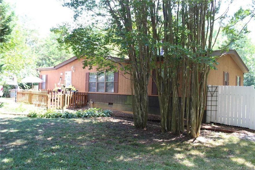 Recently remodeled 3 bedroom 2 bath doublewide with 2 acres, plenty of mature plantings and a horseshoe driveway. Interior includes a fireplace, island, newer paint and flooring. Exterior includes a two level deck (top level is new, lower level is composite), wired storage building, fenced in rear yard and two carports. Most furnishings are also available for sale.