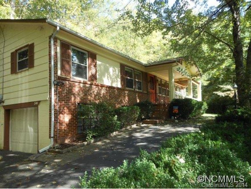 Raised Ranch-3 Bdrm./2 Bath Home, just above the Maggie Valley Country Club. A short Golf cart ride to the Course & amenities. Year Round Mountain views, One level living, Covered Front Porch, Open Floorplan, backyard Stone Patio for entertaining, Hardwood Floors, recently added hot water heater, heat pump/compressor & windows, all in an established, private neighborhood. Close to Skiing, Horse Ranch, hiking & Cherokee.  Easy driving access!