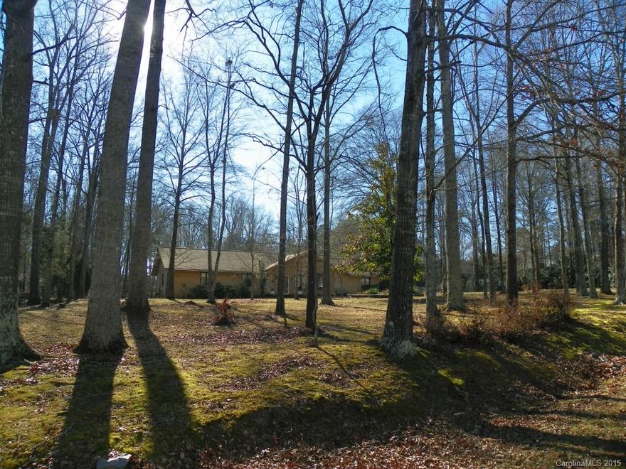 !!! CUSTOM HOME BUILT TO ACCOMMODATE HANDICAP HOMEOWNERS !!!  Beautiful setting = 2.52 Acres, Backyard go well beyond the back fence line / Lots of Storage buildings in back / NO Carpet - Laminate & Tile floors thru-out / Large Family Room with Volume ceilings & Velux Skylight & recess lighting / Fabulous Sunroom with adjoining 19x24 Covered Patio + Fenced Backyard / Garage + 10x12 adjoining HEATED Workshop / Big Kitchen w/Silestone Countertops & Tile Floors / HUGE 22x15 Master Bdrm + 12 WIC.