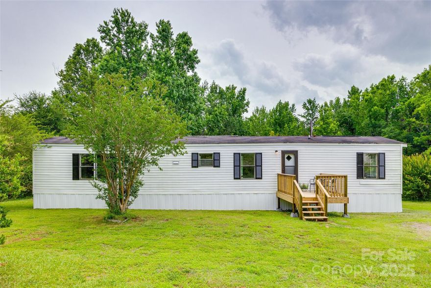 Welcome home to this nicely updated 2-bedroom, 2-bath manufactured home situated on a spacious lot in the peaceful Lesslie community of Rock Hill. This move-in-ready property has been freshly renovated including a new HVAC system and luxury vinyl plank (LVP) flooring throughout. The heart of the home features a stunning new kitchen, complete with crisp white shaker cabinets, granite countertops, and brand-new appliances—a dream for any home chef. The home offers two full bathrooms, and two well-sized bedrooms. Enjoy outdoor living on the new front deck or make the most of the spacious backyard.  Located just minutes from shopping, dining, and schools, this property also offers easy access to I-77, making commuting to Charlotte or surrounding areas a breeze. Don’t miss this opportunity to own an affordable, updated home on a large lot in a quiet, convenient location. Schedule your showing today!