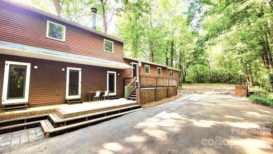 Surrounded by privacy and plenty of trees sits this rustic style split level home. Good floor plan house on over 3ac lot with pond and storage. Great location , fenced property with two automatic rolling gates . currently home is on a well and septic but both utilities are avail at the street.