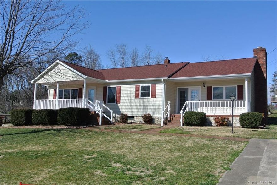 Fully remodeled home w/ extra lot! New kitchen w/ stainless appliances. Cozy den w/ wood FP. 3 main level bedrooms. Tile floor in kitchen & baths, HWs everywhere else. Relax in the 4 season sunroom w/ skylights & patio access. Lots of parking (boats, RV's,etc), mtn view from porch, new roof. Detached garage/workshop. House is heated by a heatpump. Unfin basement has single car access & lots of storage. Extra lot is flat, has power, 3bed septic permit, city water, driveway, but not subdividable.