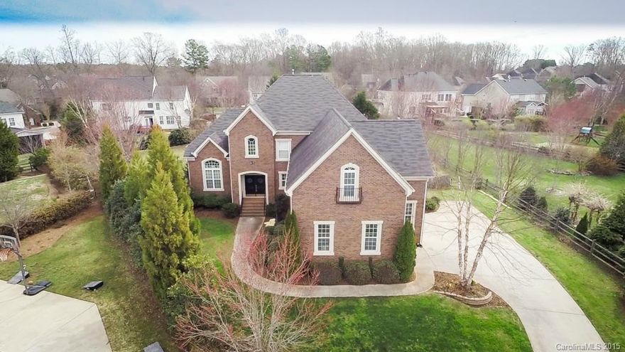 This premier full-brick home with a rare 3-car garage sits on one of the largest lots in MacAulay--and in a cul de sac. Open floorplan with granite, tile backsplash, 42" cabinets in kitchen and adjoining morning room/sunroom.  A bedroom/office with adjoining full bath downstairs; huge master up and even "huger" bonus room! Assigned to beloved Grand Oaks Elementary School. So close to shopping at Birkdale Village and easy commute to Charlotte. Home warranty provided. See the Virtual Tour.