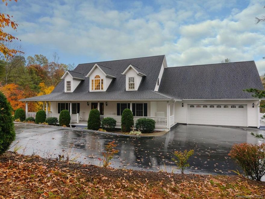 Rare find! BIG house on private lot WITH in ground pool & year round views! Open plan living areas with cathedral ceiling & hardwood floors. Gorgeous hand made solid cherry cabinetry in big eat in kitchen with breakfast bar. Formal dining too. Master on main with walk-in closet & spacious bath, plus 2nd bedroom or office on main. Big bonus room with closet. Covered front & back porches.  Full "unfinished" basement w/bath & separate workshop with own garage door. Tons of storage too!