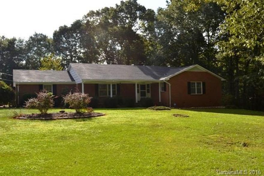 What a doll house!  Beautiful hardwood and tile flooring and new carpet.  This all brick ranch is move in ready.  Updated kitchen with stainless appliances, large living room, dining room and den with fireplace.  Remodel baths, new light fixtures.  Double garage with new garage door opener and a carport cover, storage building and new roof.  Huge lot!