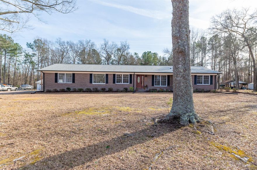 Come and enjoy all this COMPLETELY UPDATED HOME has to offer.  This brick home is situated on over an acre(1.3)
with large mature trees. You'll love the large dining/breakfast area, with lots of nature light.  The all new kitchen (new cabinets, countertops, stainless steel appliances) is open to the large great room with fireplace. French doors from the great room open into a wonderful sunroom. The primary bedroom is HUGE. Has a very large walk-in closet that has a great closet organizer system. The primary bath has double sinks, granite counter tops. The 2 secondary bedrooms are good size and there's a hall bath conveniently located for guests. This home has a room that could be used as an office. And with all the house has to offer, there is also an outside workshop.  Has a garage door and also an entrance door.  You must come check all this home has to offer.