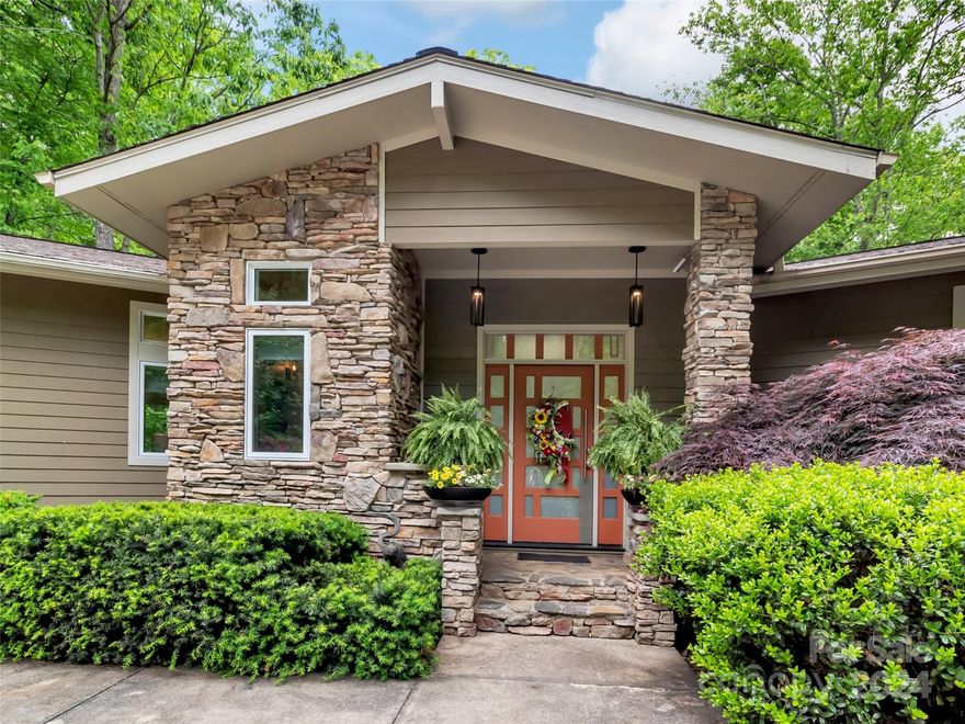 Welcome to your Serene Sanctuary at Laurel Ridge Country Club! Escape to this private paradise, situated on 3.5 acres of picturesque landscape. This stunning home offers a blend of tranquility & luxury just minutes from downtown. Be prepared to be captivated by the natural beauty that surrounds you, as you hear the sounds of the creek & waterfalls cascading down the mountainside. Enter the beautiful private drive, as you admire the grounds adorned w/gorgeous stonework. Exquisite design w/spacious living areas flooded w/natural light. Enjoy hosting intimate gatherings or grand entertaining against the backdrop of panoramic mountain views. Unwind on the sprawling deck, while overlooking the mountain views & relax by the stone firepit. Spacious gourmet kitchen w/ample cabinetry, dbl ovens, gas range & warming drawer. Luxurious primary suite, where tranquility awaits. 3 ensuites, plus bonus room bdrm/office. Full house generator.  Enjoy this private retreat enveloped in nature's splendor!