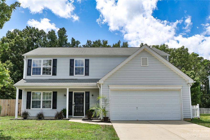 Fabulous 3 bedroom 2 1/2 bath home in an established community features easy maintenance vinyl exterior with dual car garage and ample parking. Rear yard is completely fenced, enjoy private gatherings on the rear patio. The covered front porch runs across the front entry for plenty of rocking chair space. Updated kitchen features stainless appliances. Formal dining room with plenty of space for entertaining or cozying up for an evening in. Gas log fireplace with pretty surround welcomes you in cooler months. The generously sized master bedroom is upstairs and features a beautiful bathroom with a garden tub with separate shower. Large secondary bedrooms with sliding door closets also upstairs.