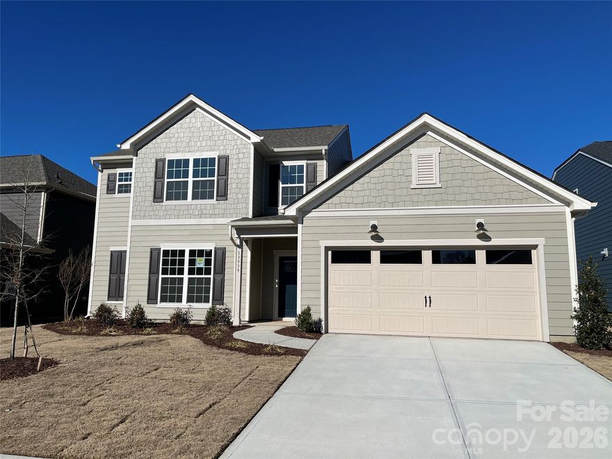 The Furman plan features a 1st floor primary bedroom.  Its open-concept floor plan offers large Gathering room,  Fireplace with granite surround, gourmet kitchen with stainless steel gas appliances, upgraded cabinets and quartz countertops, Everyday Cafe, Library/office, Powder Room, Laundry Room and Sunroom with patio.  Owners’ Suite bathroom offers large walk-in shower with extra overhead rain shower head and tankless water heater.  Upstairs includes open loft plus 3 more spacious bedrooms and 2 full bathrooms.  HOA fees include High-Speed Internet and TV service. Located just around the corner from Rivergate Shopping, McDowell Park and Lake Wylie, offers lots of convenient shopping, dining and recreation. Contact us to learn more!  Generous finance incentive available with use of our preferred lender.