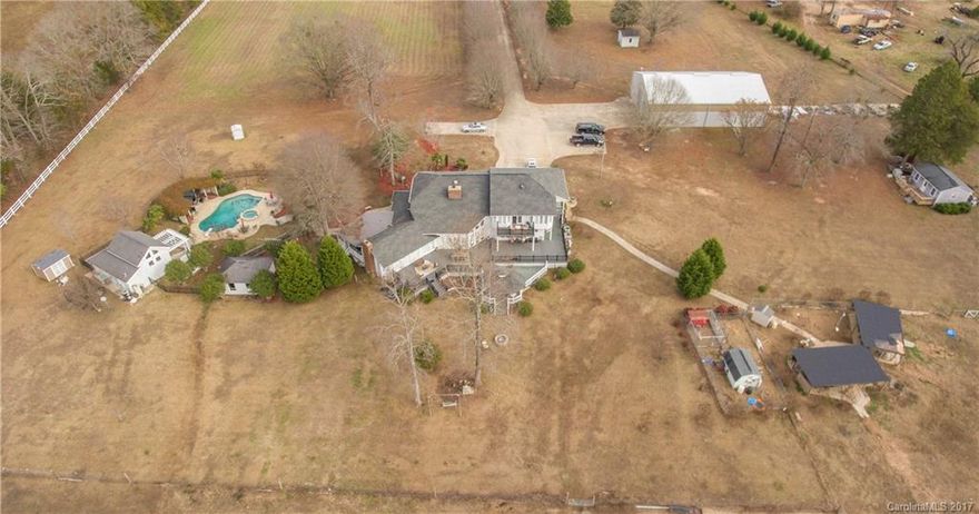 Motivated Seller!!! Private 4,000 sqft Gated Estate on approx 40 acres! Main home has 2 master suites updated kitchen with high end appliances. 4 bedrooms 3 full baths. Entire property is fenced. Perfect property for horse farm complete with pool house and secondary building that features a motor hoist, air lines, lighting, and insulated roof. Possibility to build other homes and/or structures on the property. Additional septic systems already installed.
WILL CONSIDER SWAP WITH HOME IN YORK