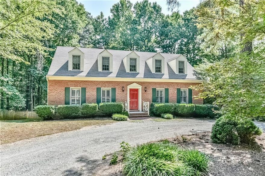 Full brick 3BR,2.5BA home on .57 acre lot,desirable Pine Road.Master BR down, renovated kitchen & master bath by International K&B.Large deck & private fenced backyard. Beautiful woods rear of lot.Basem rec room,Garage w/shop & access door.Great storage,plantation shutters,Excellent parking w/circular front drive, +garage.Large walk-in attic for possible expansion.Minutes from Davidson Greenway.Short walk/bike to downtown & Davidson College.Great opportunity/value in town! SEE VIRTUAL TOUR.