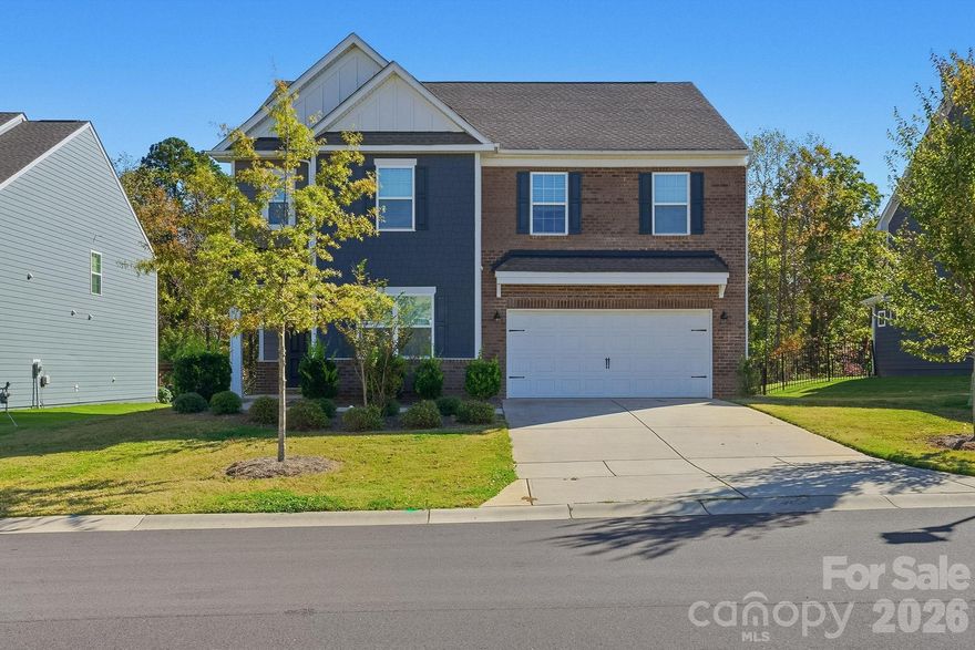 Stylish two-story home offering 4 bedrooms and 2.5 bathrooms with modern design touches throughout. The kitchen features a large island, pantry, stainless steel appliances, accent lighting, and a sleek subway tile backsplash. A spacious living area opens to a large fenced backyard, ideal for outdoor enjoyment. The primary suite includes a double vanity for added convenience, while another bathroom also features a double vanity. A versatile loft provides additional living or workspace. The home is completed by a two-car garage and a comfortable, functional layout perfect for everyday living.