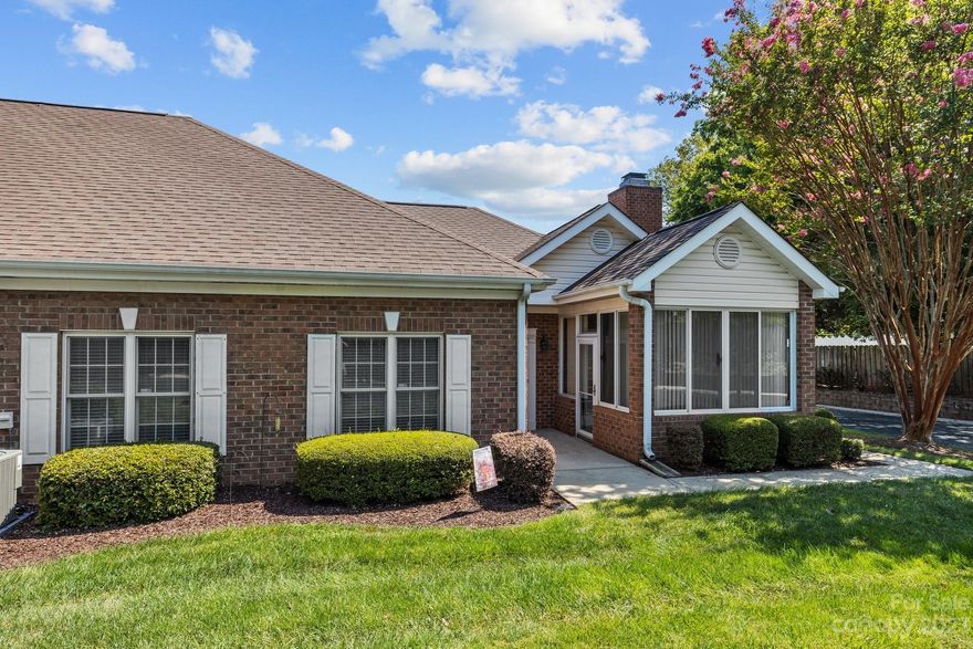 NO STAIRS ... WHO CARES? Well, apparently many people do. Rare one level end unit in a beautiful setting and location that is both convenient and functional for accessing all of our area's offerings. This home features a large family room with vaulted ceiling and newly installed plank flooring. Updated kitchen has gas range and hood, granite countertops and plenty of cabinets to ease your daily preparation or those special occasion dinners. The primary bedroom has a tray ceiling, two double windows allowing natural light galore and a large walk-in closet. Bathrooms have elegant tile floors, double sinks and new countertops to compliment the glass enclosed showers. Enjoy the privacy of your sunroom all year long. Air conditioning and furnace were replaced in 2022.  Two car garage convenience with a new, sturdy pull down stair system for easy access to additional storage space. The HOA includes water, lawn maintenance and trash removal which makes this home a perfect lock and go.