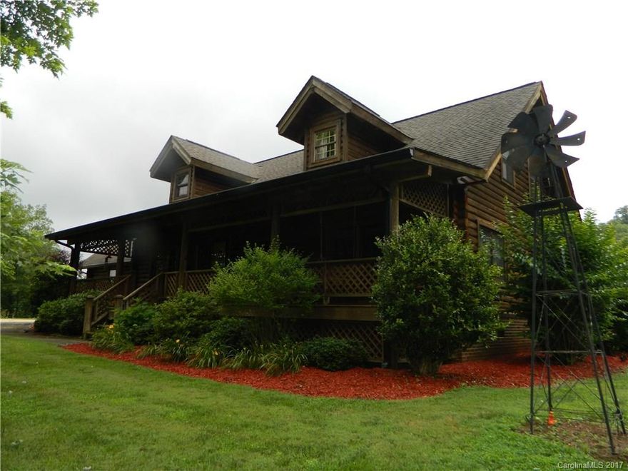 Country elegance & serenity is found in this custom log home situated on 5+ acres w/stream. Tankless H2O heater, 3 full baths, 4 BR's, closets galore including WIC in loft, fireplace insert in GR, bay window in GR, separate DR, covered rocking chair front porch, large rear deck w/built in seating, 12x24 outbuilding w/attached 12x24 shed, 15KW generator, 24x24 SL garage, exterior lighting, & meticulously landscaped. This one is a must see to appreciate all the little details throughout.