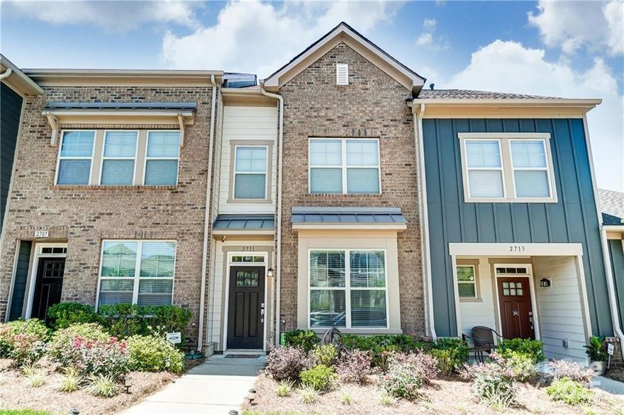 Welcome to 2711 Tranquil Oak Place – a beautifully maintained 2-bedroom, 2.5-bath townhome with a spacious loft, ideally located just minutes from Uptown Charlotte. This open-concept home offers modern finishes, abundant natural light, & versatile living space perfect for working from home or entertaining. The kitchen features granite countertops, stainless steel appliances, & a breakfast bar, while flowing seamlessly to the dining area & living space. Upstairs, you'll find the primary suite, laundry & loft that can be used as bonus area, extra guest space, or office. On the third level is another spacious bedroom & full bath, with walk-in closet & walk-in attic space. Enjoy the convenience of a 1-car garage & easy access to shopping, dining, parks, & major highways. Available for $2,400/month – don’t miss the opportunity to live in one of Charlotte’s most desirable locations! Brown cabinets in island and in both full bathrooms have been painted grey & now have black hardware.