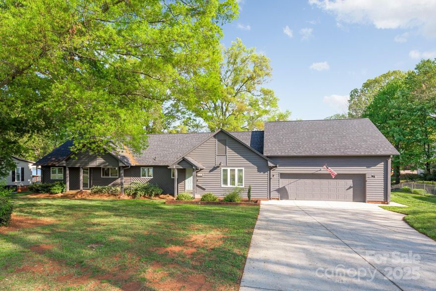 Experience the best of lake living with no HOA! This stunning 4-bedroom home is perfectly situated on the shores of Lake Norman. Enjoy breathtaking sunsets from the screened porch or covered deck, creating the perfect backdrop for relaxation.  The kitchen boasts upgraded cabinetry and a large center island that seamlessly flows into the spacious living room, anchored by a charming brick fireplace. The primary suite offers private access to the screened porch and includes an en-suite bath. Two secondary bedrooms share a full bath, while an additional pair of bedrooms share a separate bath—ideal for guests. The upstairs loft provides space perfect for entertaining. The garage has been thoughtfully converted into an entertainment space—ideal for hosting gatherings. Outside, follow the walkway to a covered dock, the hot tub or the separate patio and fire pit area, perfect for lakeside evenings. New roof 2024. New dock 2022. Septic expansion approved. Ask about Airbnb income if interested.