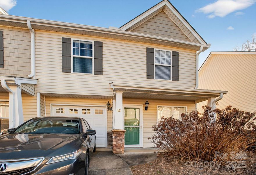 Now selling below tax value!! Back active at no fault of the seller! Beautiful corner-unit townhome in the heart of Fletcher! This 3-bedroom, 2.5-bath home offers over 1,300 sqft of comfortable living space with a spacious living room featuring a cozy gas-log fireplace. The open kitchen flows seamlessly into the main living area, perfect for everyday living and entertaining. Enjoy outdoor living with a covered front porch and a private back patio with fencing. Additional features include a garage and extra attic storage. Ideally located between Asheville and Hendersonville, just minutes from grocery stores, Fletcher Park, Asheville Regional Airport, and local restaurants.