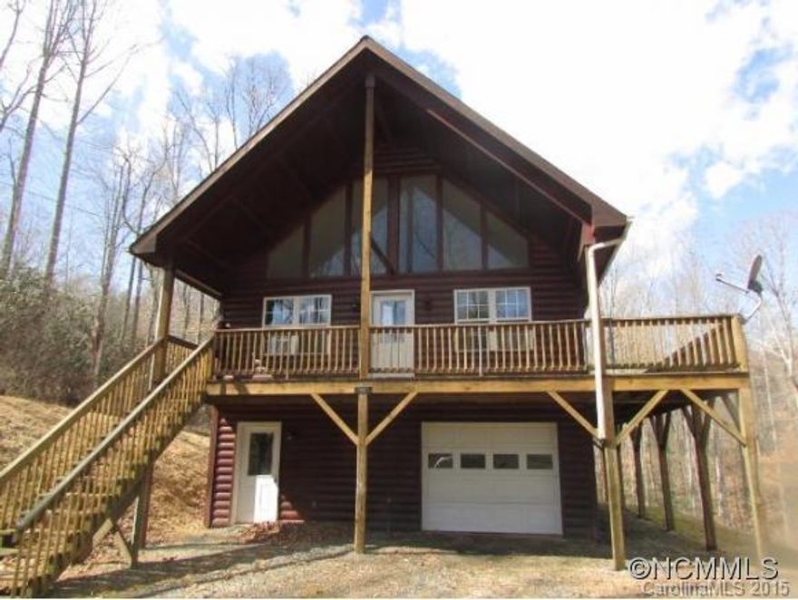 Mountain Retreat! 2005 Log Siding home tucked amongst rhododendrons. Situated on 0.90 acre lot. On main level you have open great room(Wood Floors w/stone fireplace), master bedroom wi/bath & utility area. Step-saving modern kitchen.   Upstairs loft for office space/study & bath, loft overlooks great room. Full drive-in basement with bedroom, bath & large workshop area with steps to main  level. Buyer is advised to confirm all infor.