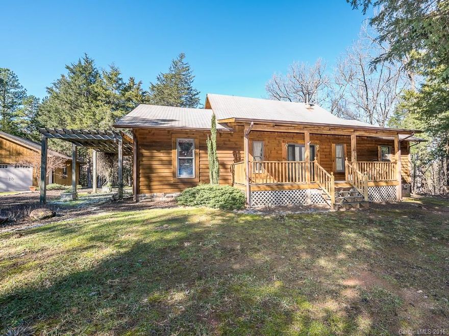 Beautiful & extremely well maintained custom built Log home on 11 ac! This 1.5 story home features 3 beds & 2 baths, a vaulted ceiling in Living, spacious dining room, & large kitchen which makes for easy indoor entertaining! Kitchen contains plenty of cabinet & counter space, a center island, & black appliances. Office w/ built in's & Murphy bed. Huge screened in porch overlooks the private backyard surrounded by mature trees! Detached 2 car garage, central vac, & security system.